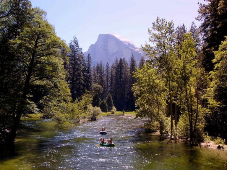 people rafting down the Merced River in Yosemite