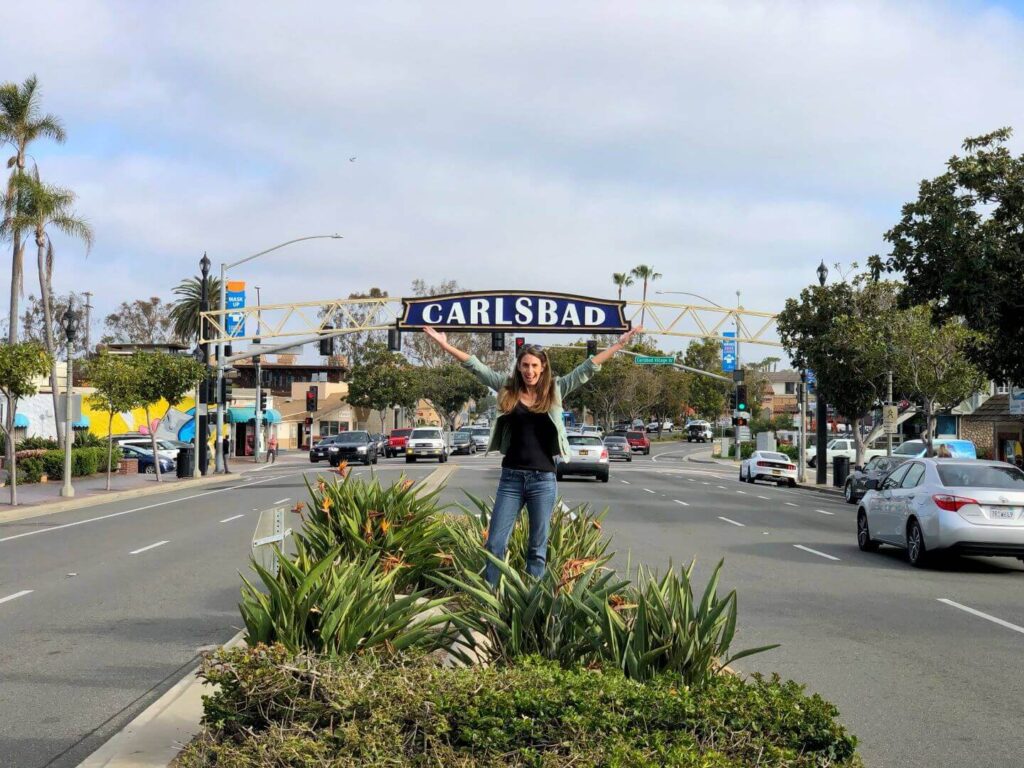 Carlsbad sign with a woman in front