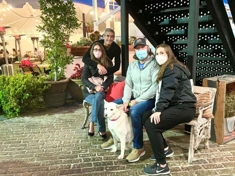 two couples and a dog in Carlsbad village