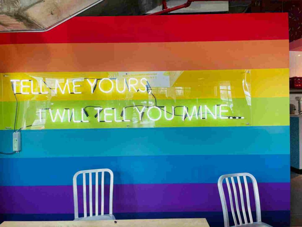Delray Beach Market rainbow sign with text