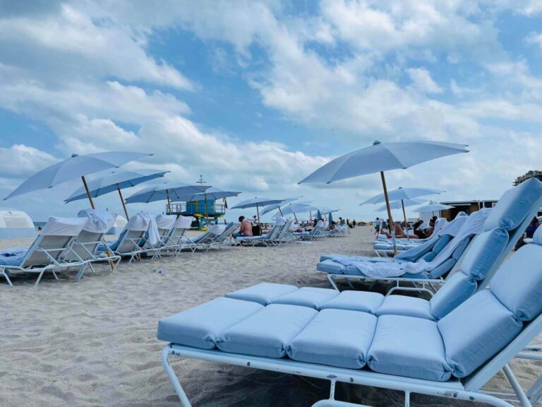 rows of beach chairs on South Beach in Southeast Florida at the Ritz Carlton