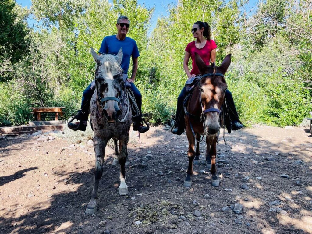couple horseback riding at convict lake