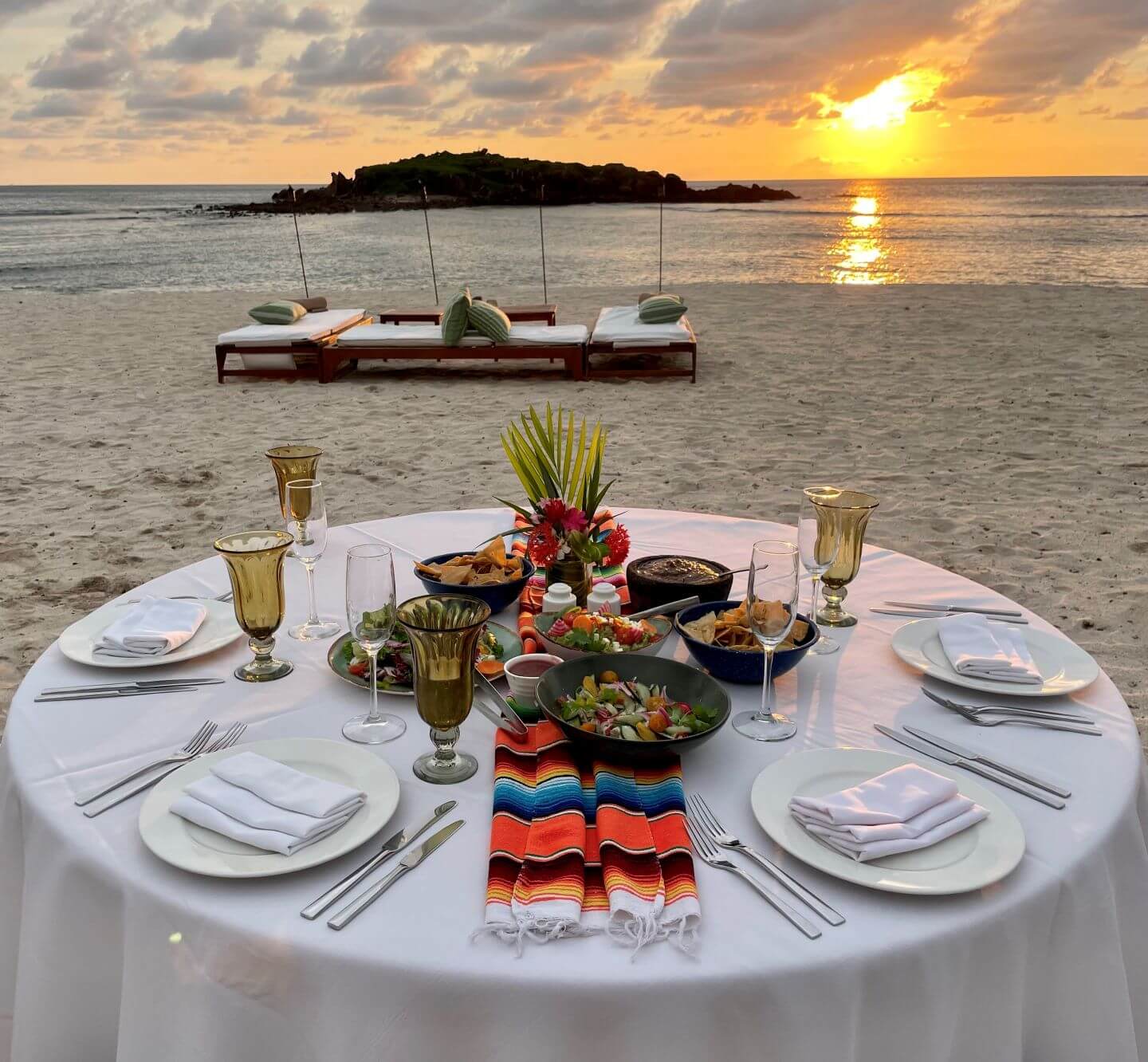 dinner setup for private bbq at The St. Regis Punta Mita with the sunset