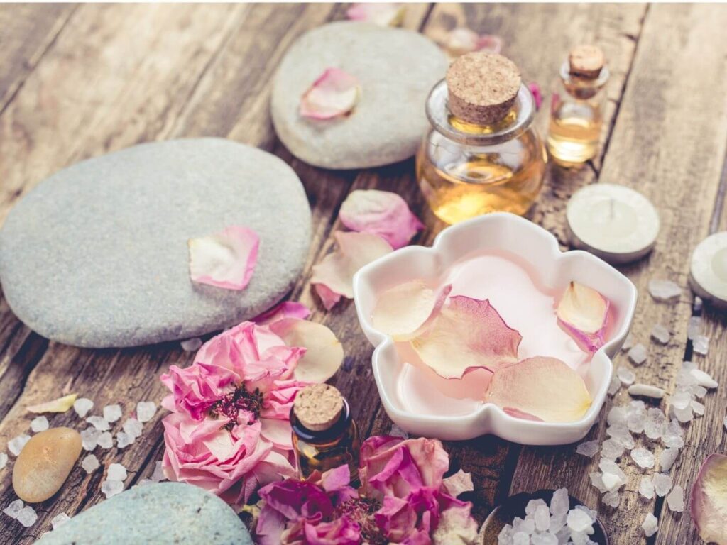 spa accessories with flowers, stones and oil