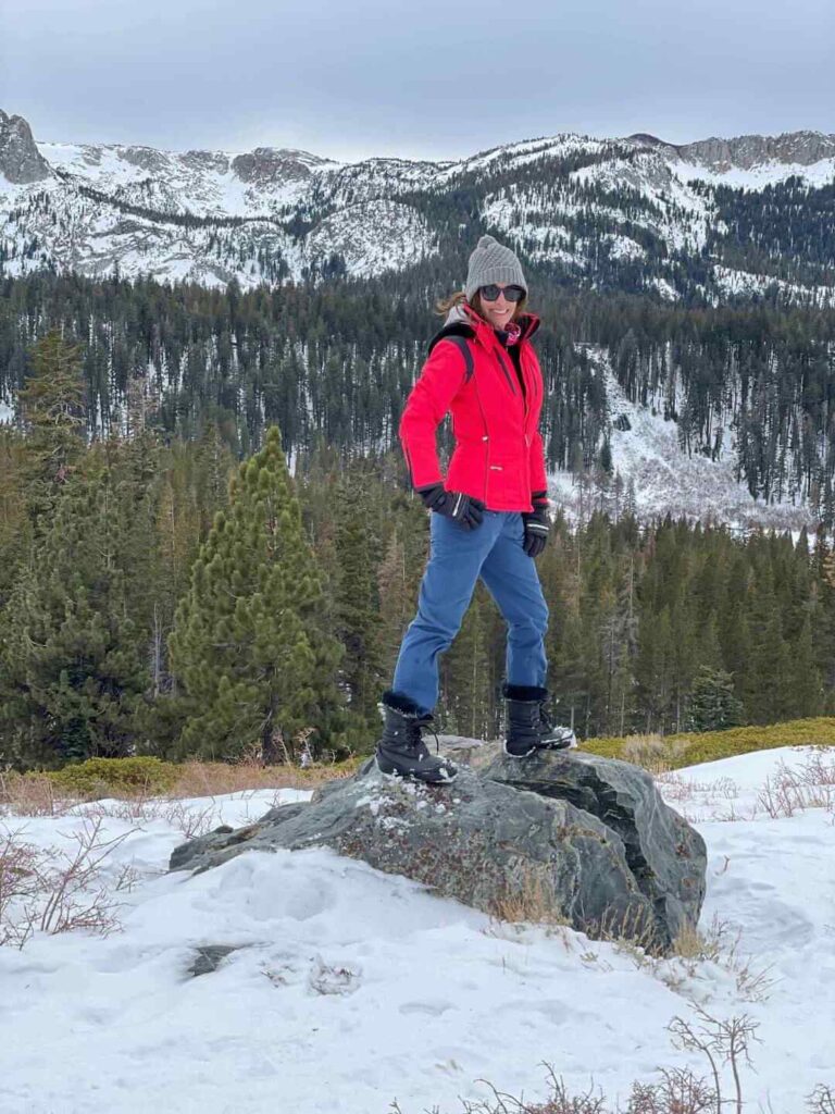 Woman standing on a rock at Panorama Dome in Mammoth Lakes in the Winter