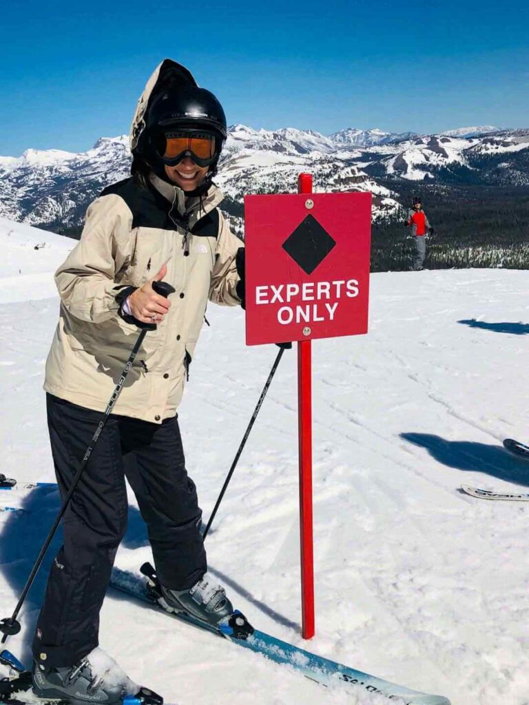 Woman at the top of Mammoth Mountain skiing
