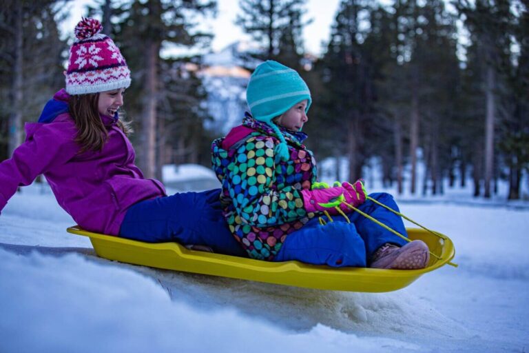 kids sledding in the Winter