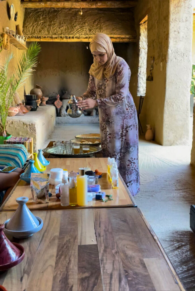 Woman pouring tea at an argon women's cooperative