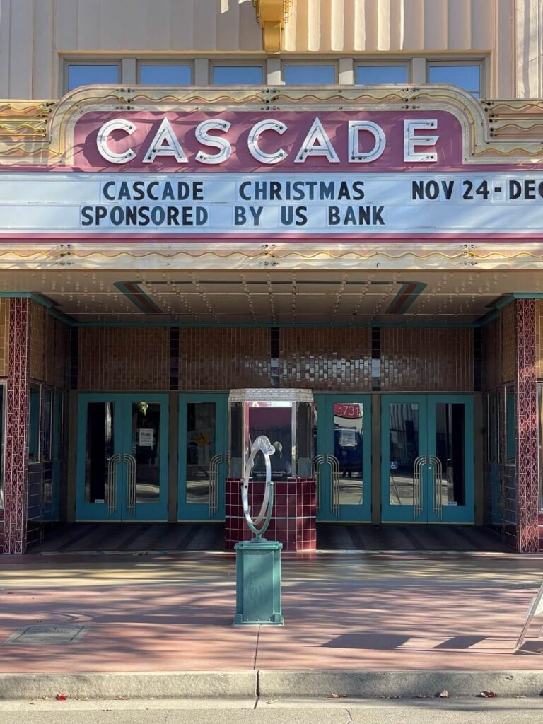A front view of the Casacade Theatre sign in art deco style