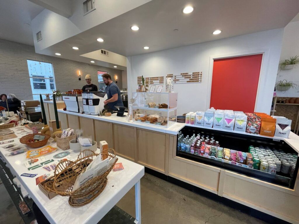 Inside Evergreen Coffee ship with a counter, and items for sale