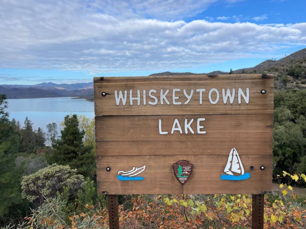 Whiskeytown Lake sign in front of the lake