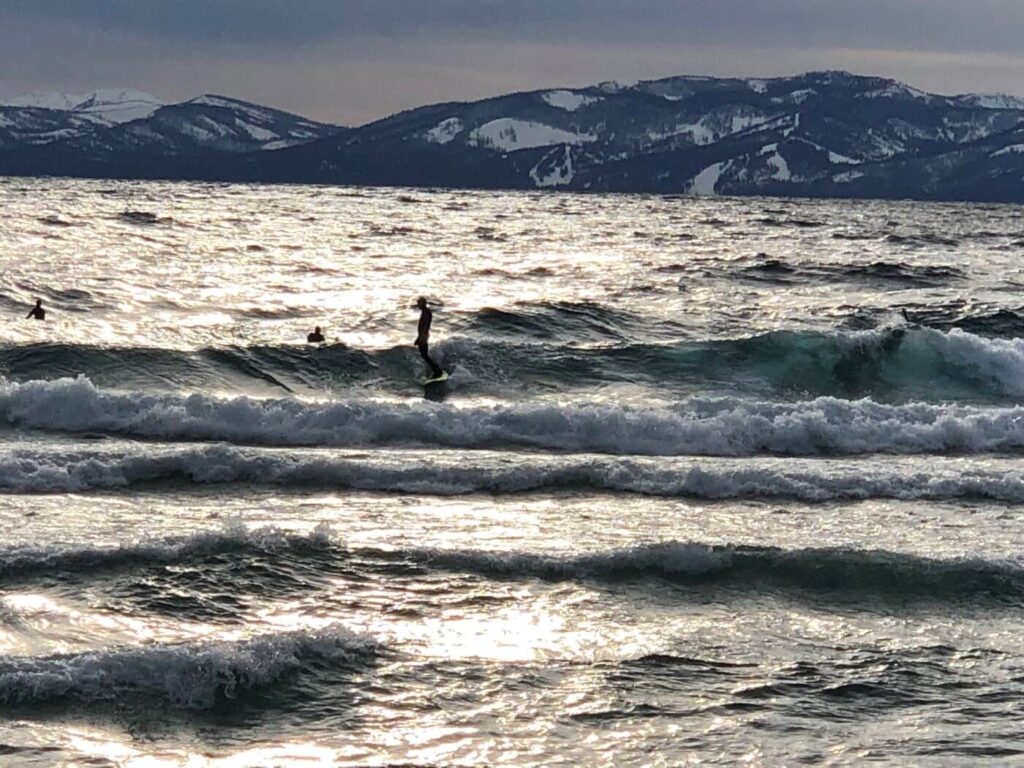 sufers on lake tahoe in the winter