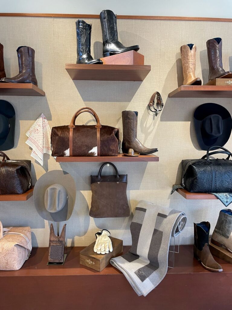 Clothing display with hats, gloves, boots, luggage