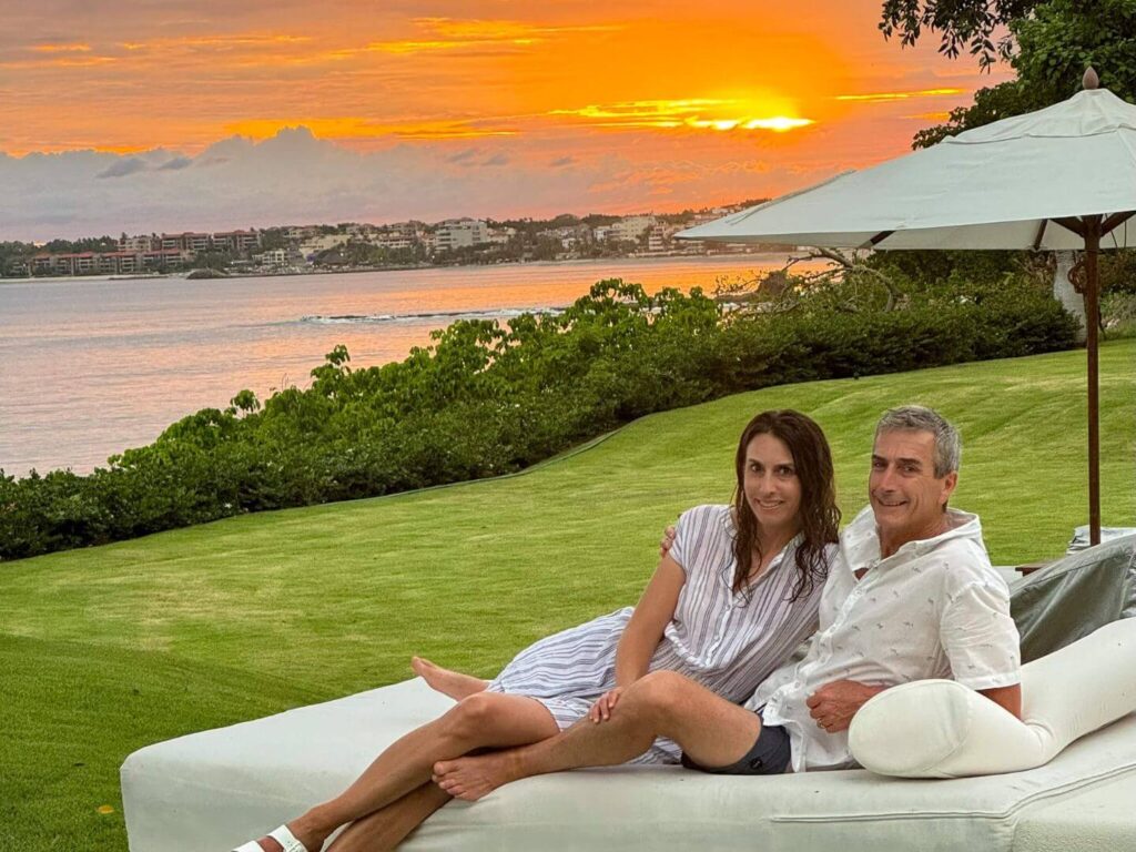 couple at sunset on a lounge chair