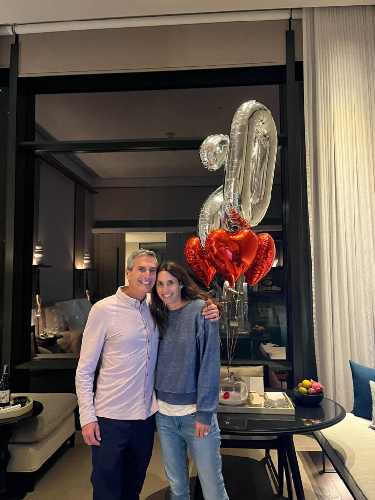 20th Anniversary Balloons in a guest room with a couple