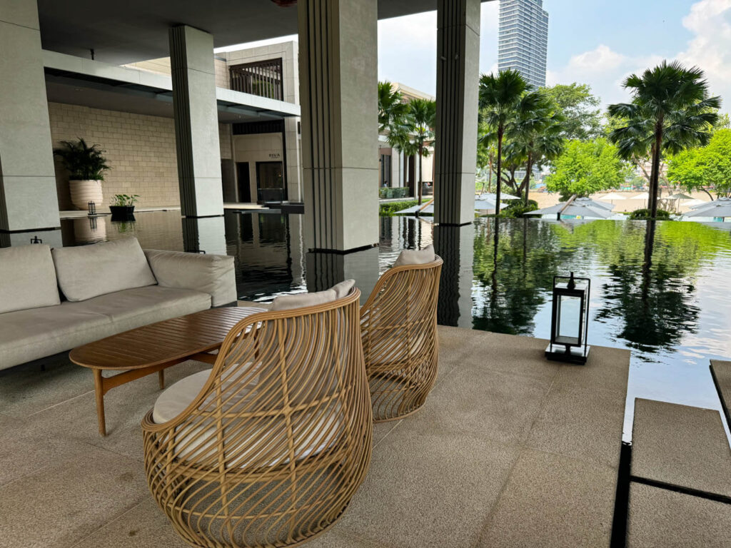 Lobby with chairs overlooking the lilly pond and river at Four Seasons Hotel Bangkok at Chao Phraya River