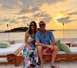 couple on the beach at sunset at the st. regis punta mita