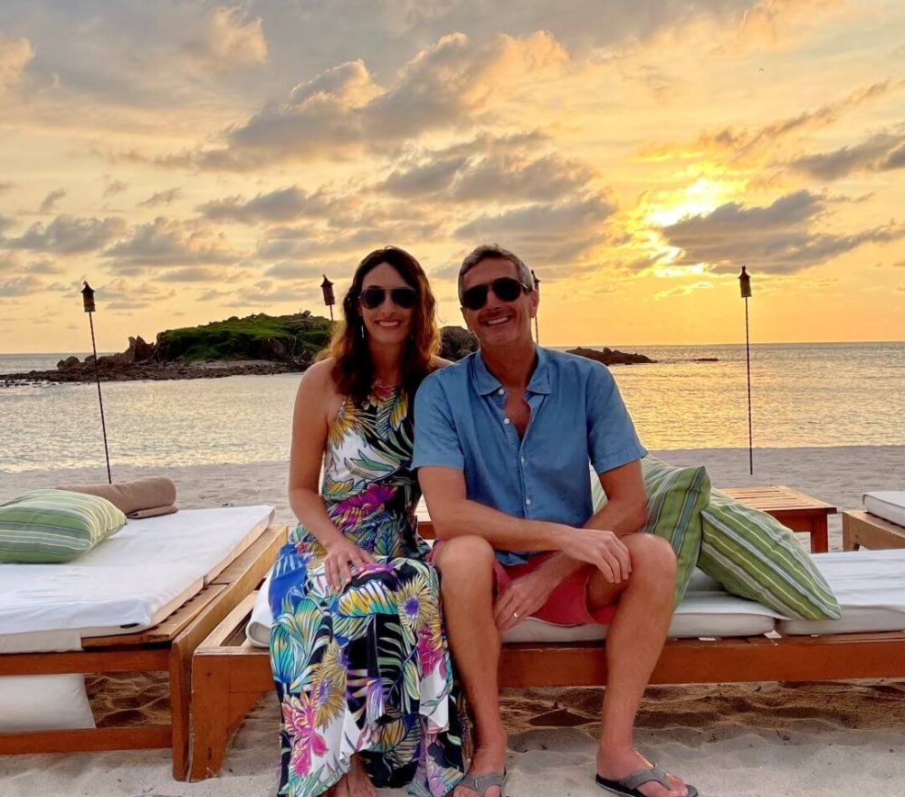 couple on the beach at sunset at the st. regis punta mita