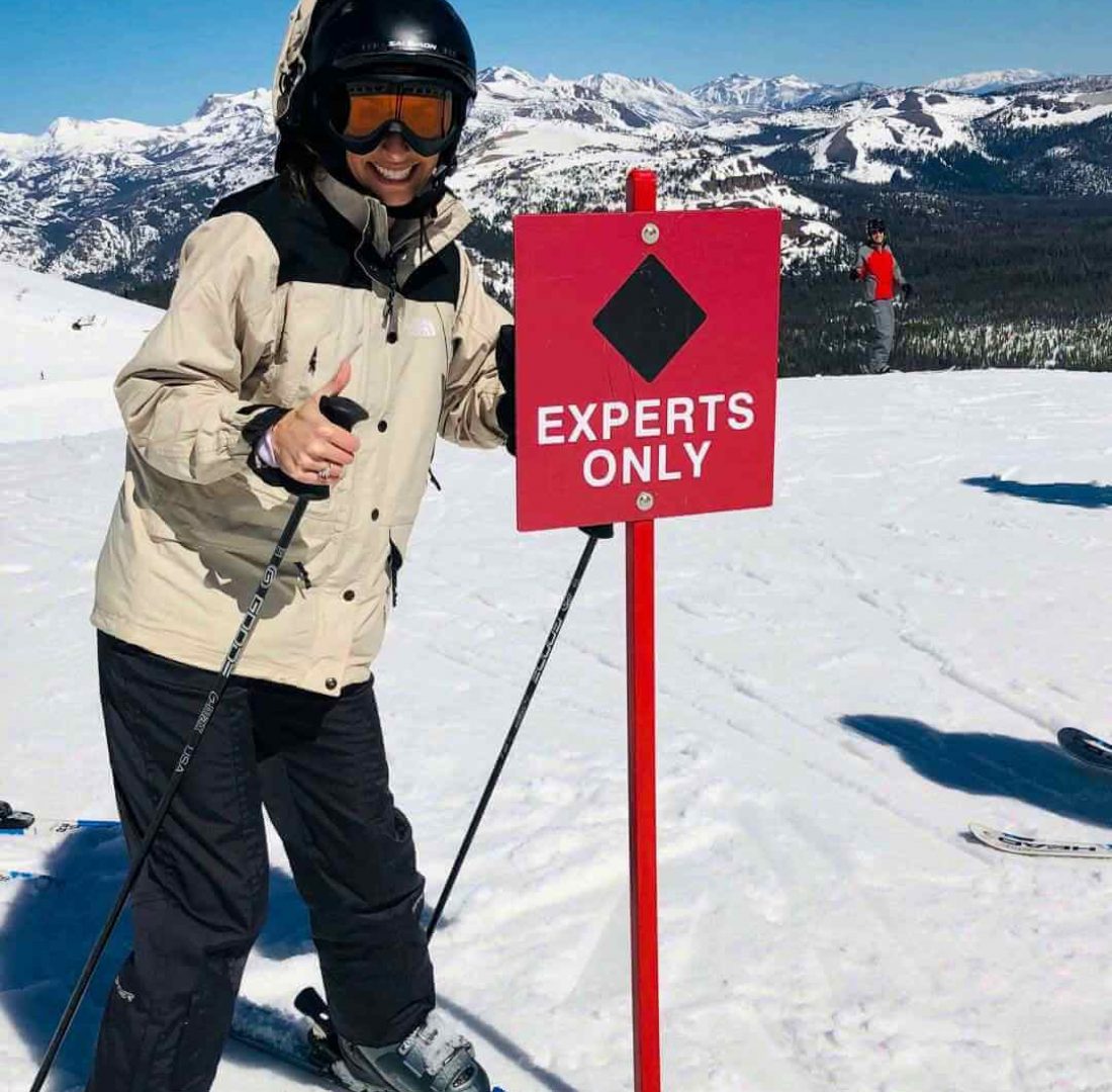 Woman at the top of Mammoth Mountain skiing