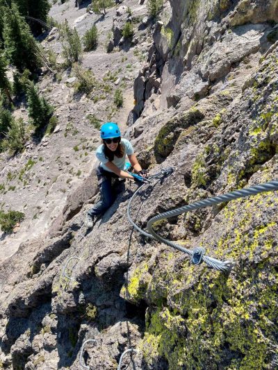 Woman climbing via ferrata on Mammoth Mountain, best things to do in Mammoth in the summer